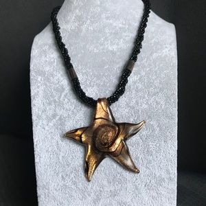 Beaded necklace with a handmade glass star